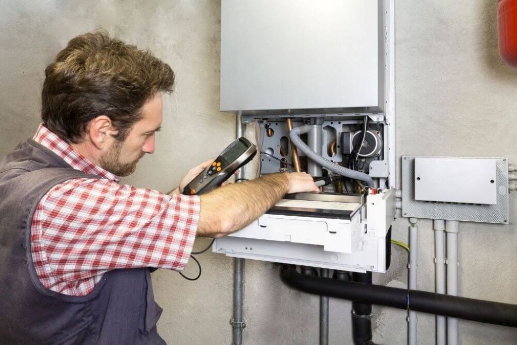 Local heating experts in Plymouth fixing a broken home boiler during winter emergency