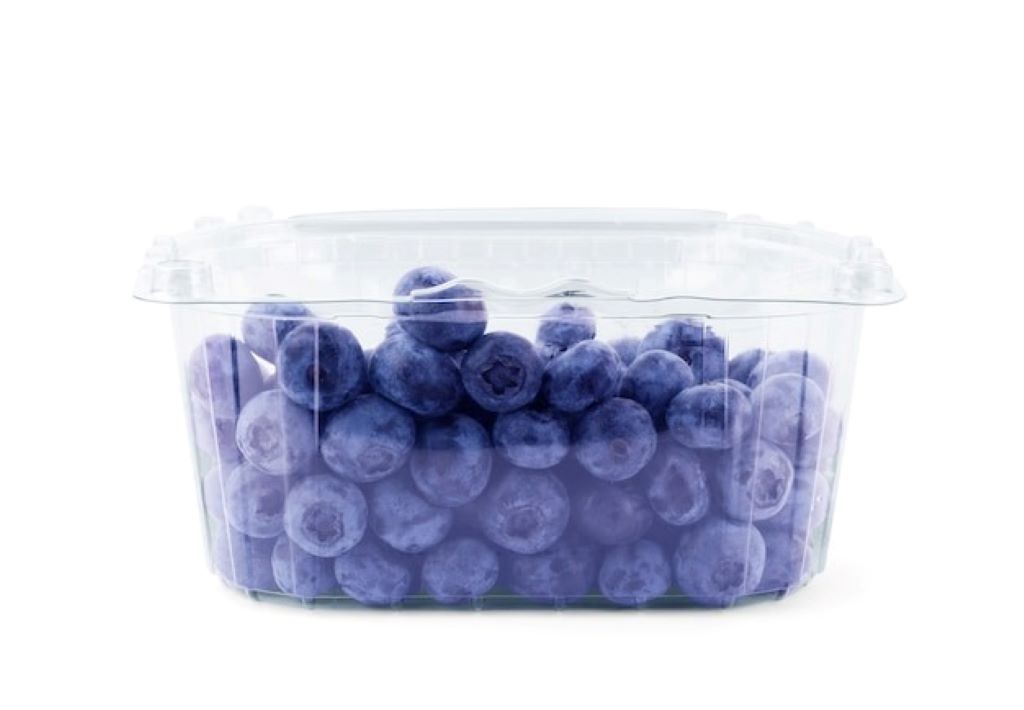Fresh blueberries in clear plastic pint container showing typical 11-ounce weight variation